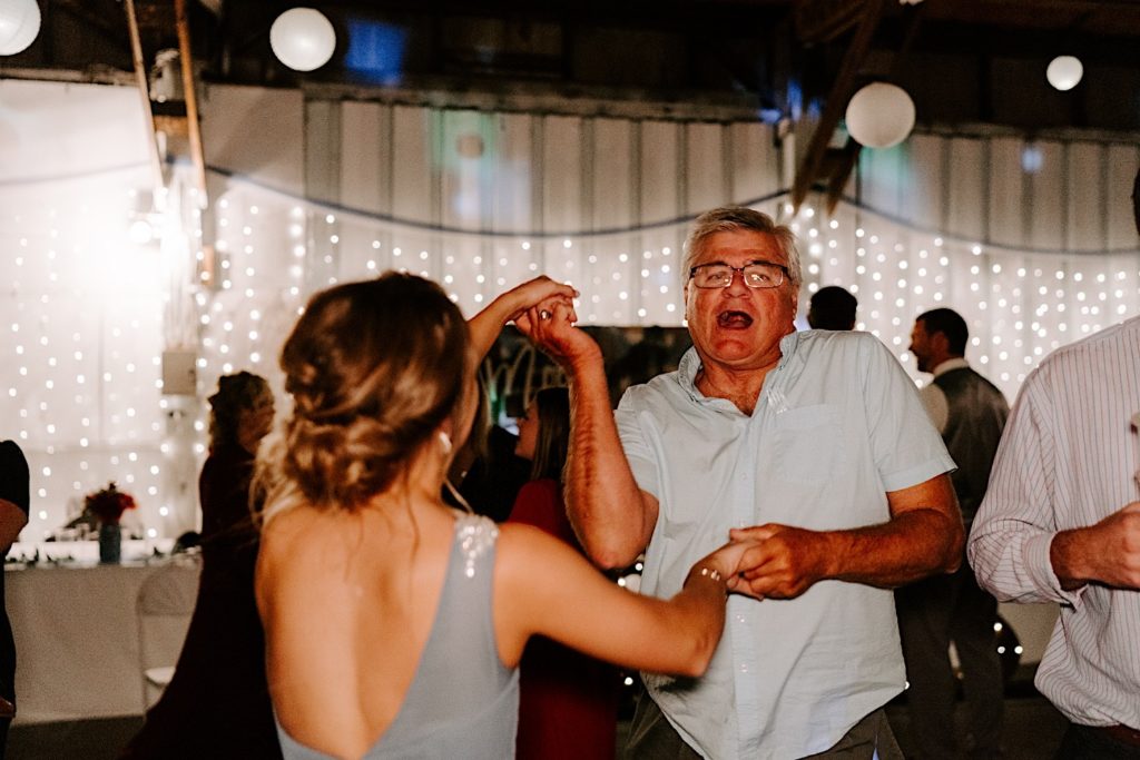 Man and bridesmaid dancing on dance floor at Indiana reception