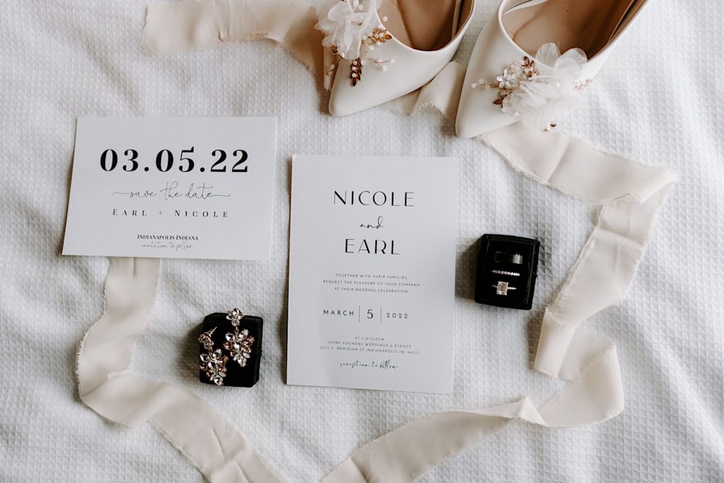 Flatlay with ivory colored wedding details