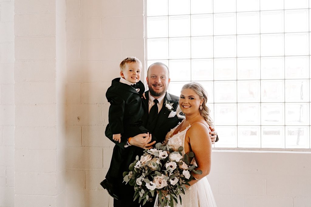 Bride and groom with their child