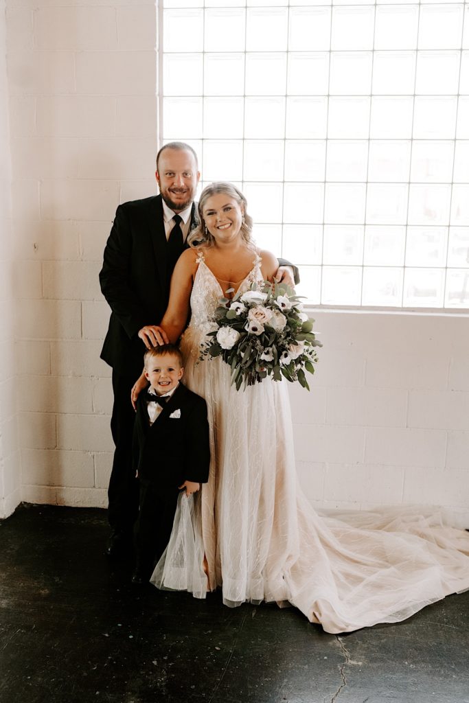 Bride and groom with their child