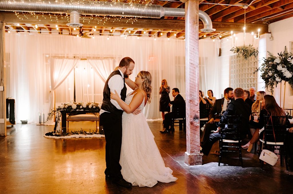 Newlyweds share their first dance at the Ivory Foundry