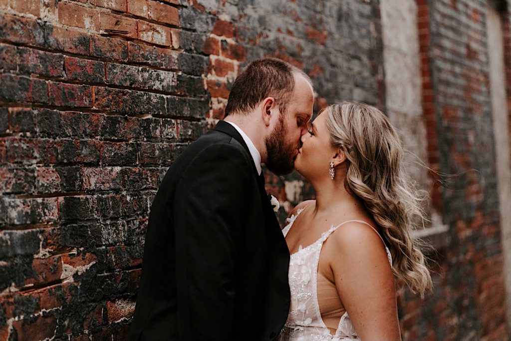 Newlyweds kiss at intimate Chicago wedding venue