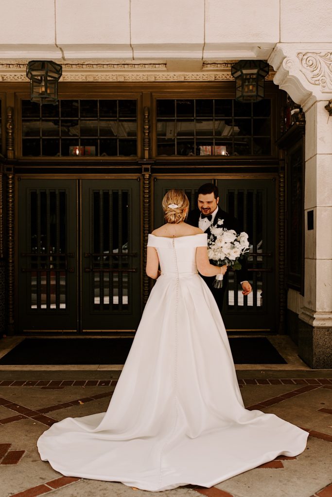 Bride and groom share a moment together outside the Indiana Repertory Theatre
