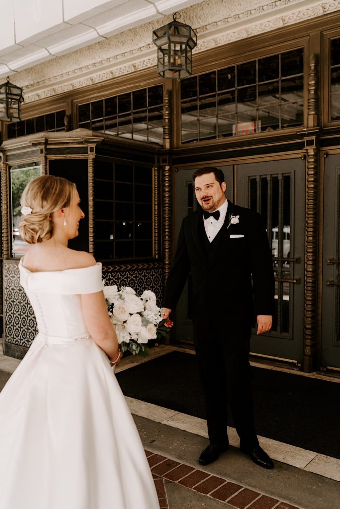 Bride and groom share a moment together outside the Indiana Repertory Theatre