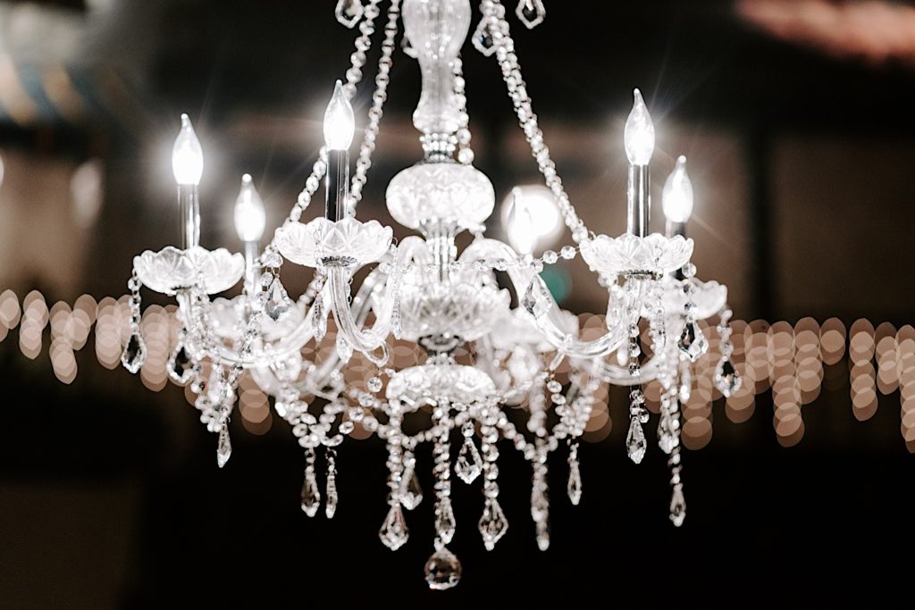 A crystal chandelier sparkling at the Indiana Roof Ballroom wedding venue