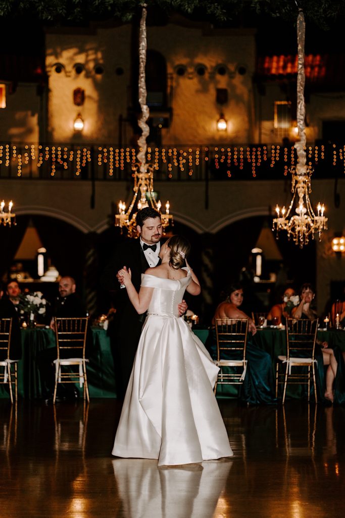 A wide photo of a Bride and groom sharing their first dance at their wedding reception at the Indianapolis Roof Ballroom wedding venue