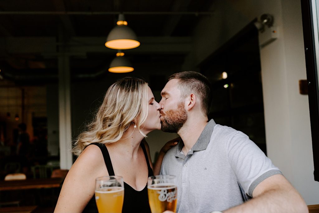 Chicago kisses during their engagement session at a Ravenswood Bar