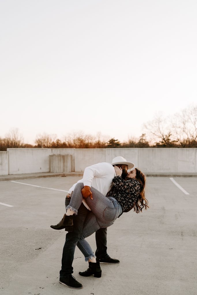 A couple dances on a Chicago parking garage during their engagement session.