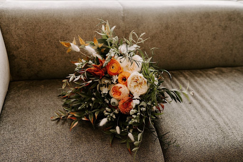 a bouquet filled with Orange flowers.