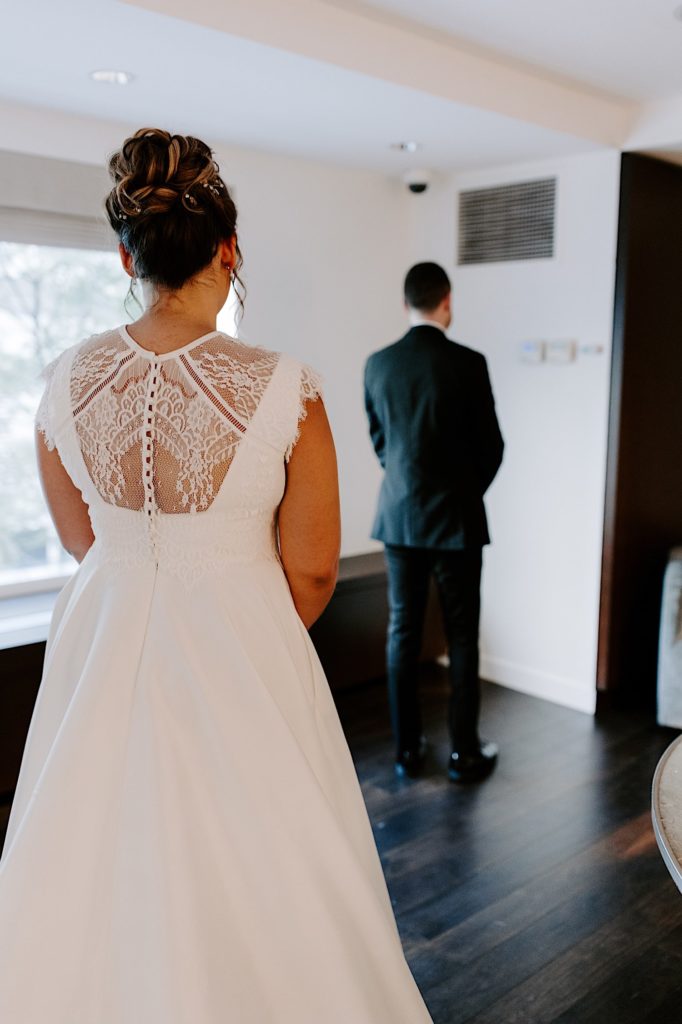 A bride gets ready to see her groom on their wedding morning for the first time in a Chicago hotel.