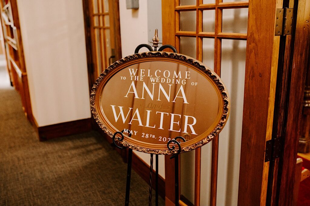 A sign reads "Welcome to the wedding of Anna and Walter, May 28th"