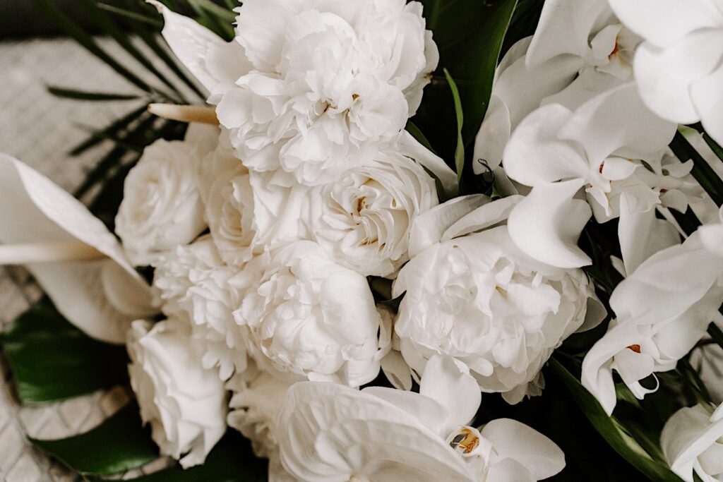Close up photo of white flowers that are part of a wedding bouquet