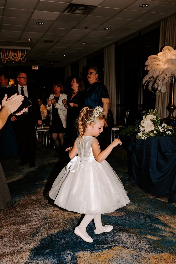 A flower girl dances during the reception at the Voco Hotel in Chicago