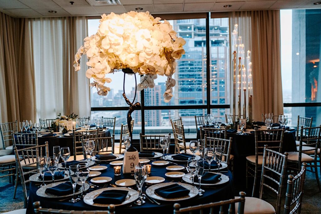 A table set up for an indoor wedding reception at the venue Voco Hotel in Chicago
