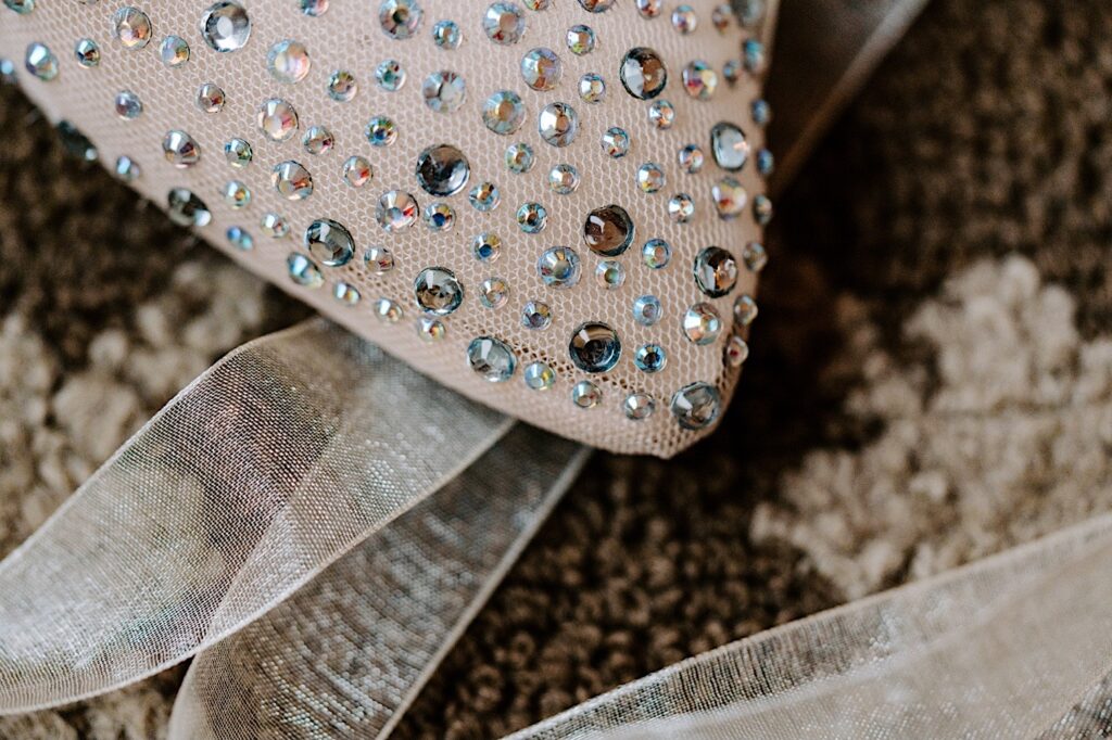 Detail photo of rhinestones on a piece of fabric