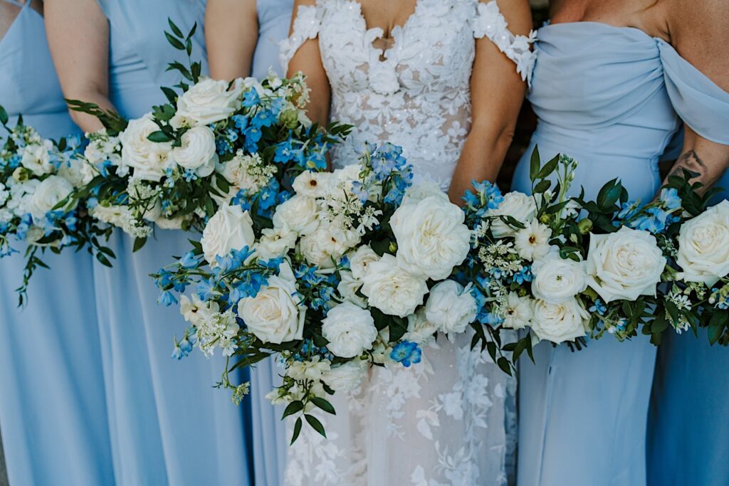 White and blue bridesmaid bouquets and powder blue bridesmaids dresses.  Wedding bouquets are made by the Chicago florist The Local Petaler